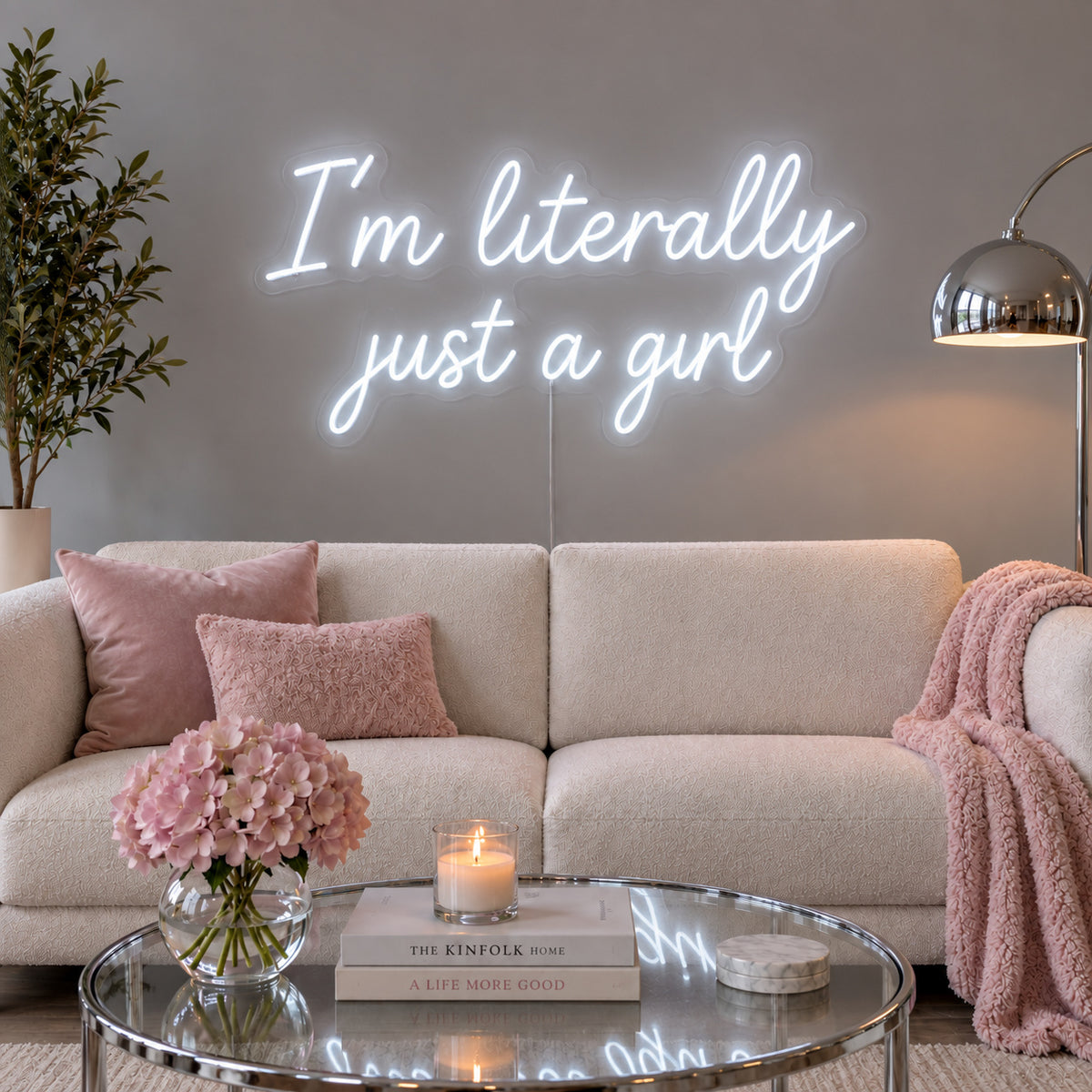I'm Literally Just A Girl Neon Sign, RGB colour-changing option shown in white above a cream sofa.