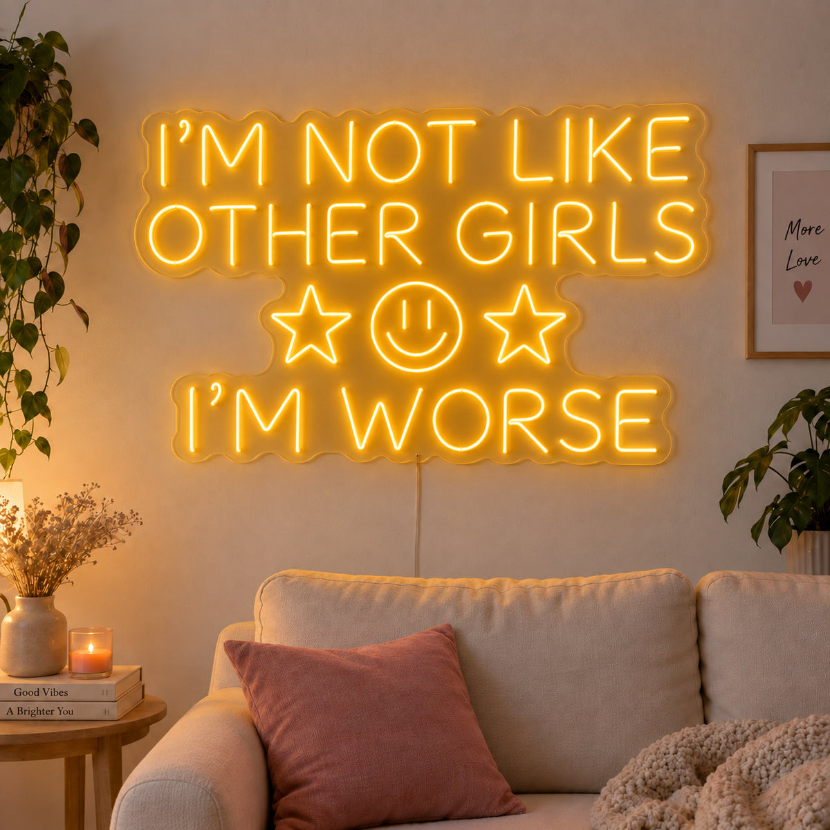 I'm Not Like Other Girls I'm Worse Neon Sign glowing gold with stars and a smiley face above a cream sofa.
