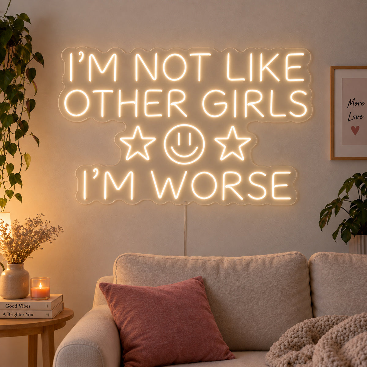 Warm White version of the I'm Not Like Other Girls I'm Worse Neon Sign, shown with stars and a smiley face above a cream sofa.