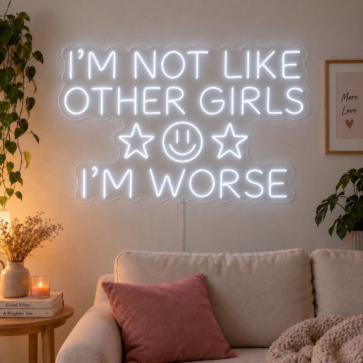 I'm Not Like Other Girls I'm Worse Neon Sign glowing white with stars and a smiley face above a cream sofa.