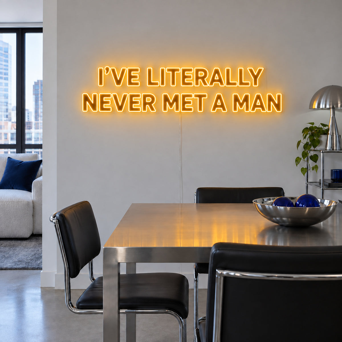 I've Literally Never Met A Man Neon Sign glowing gold above a dining table.