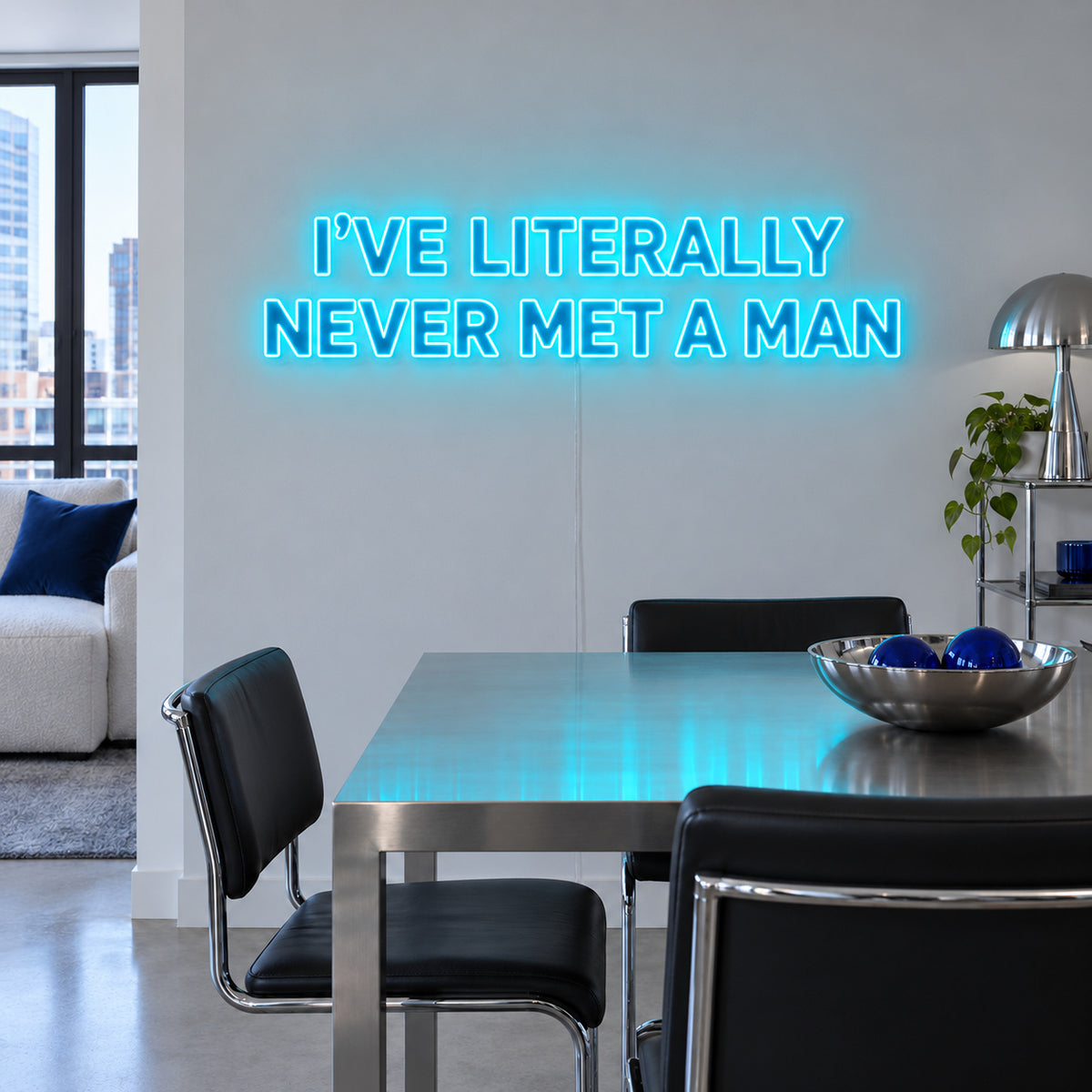 Ice Blue version of the I've Literally Never Met A Man Neon Sign, shown above a dining table.
