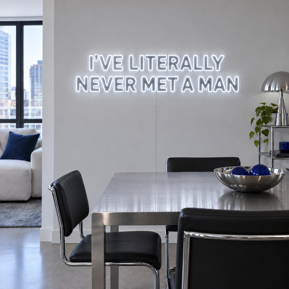I've Literally Never Met A Man Neon Sign, RGB colour-changing option shown in white above a dining table.