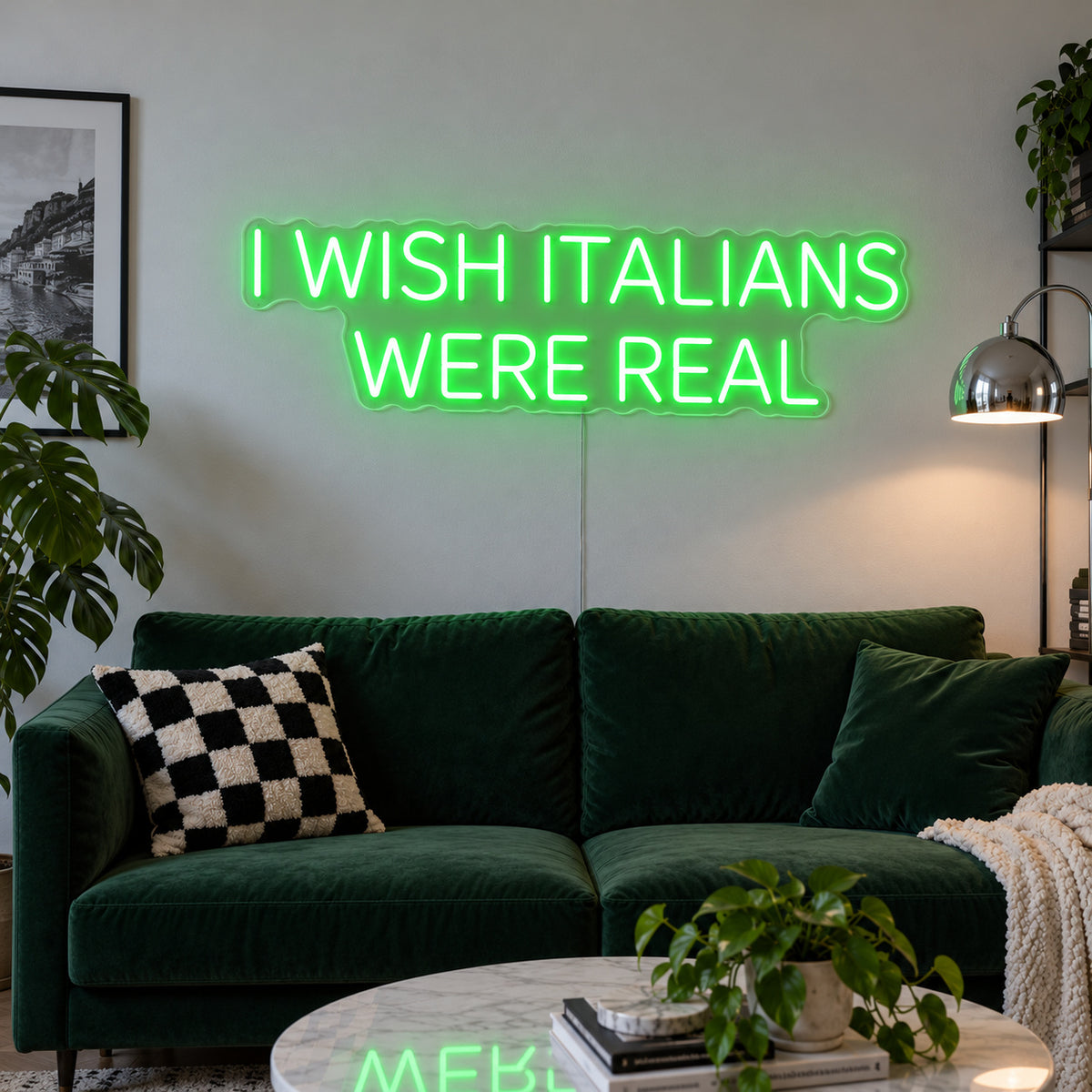 I Wish Italians Were Real Neon Sign with green lighting, displayed above a green sofa.