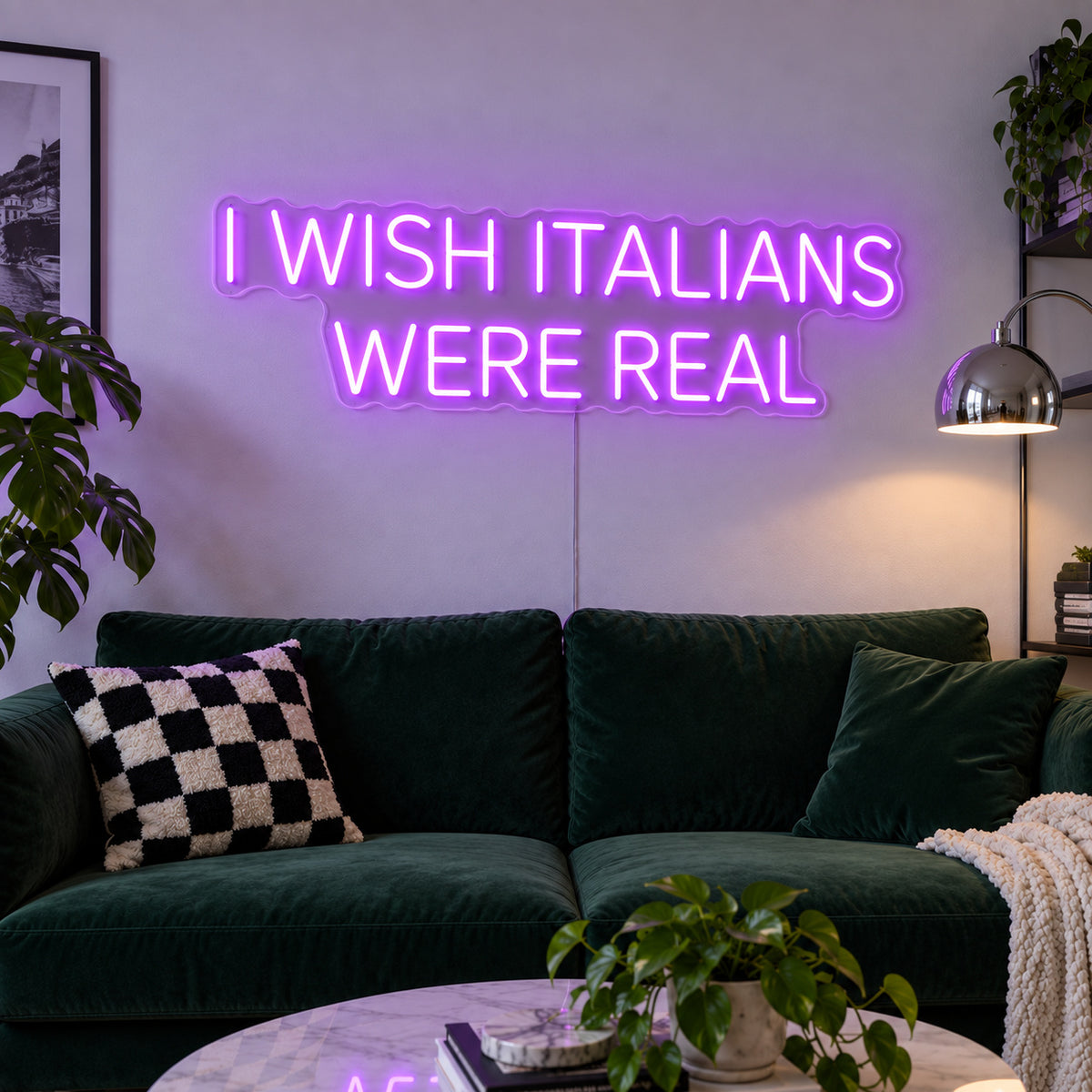 I Wish Italians Were Real Neon Sign with purple lighting, displayed above a green sofa.