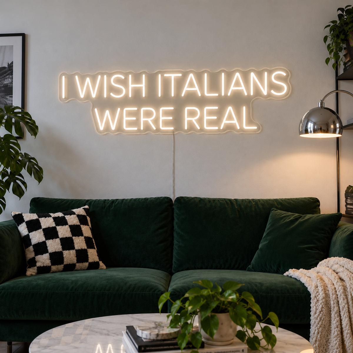 Warm White version of the I Wish Italians Were Real Neon Sign, shown above a green sofa.