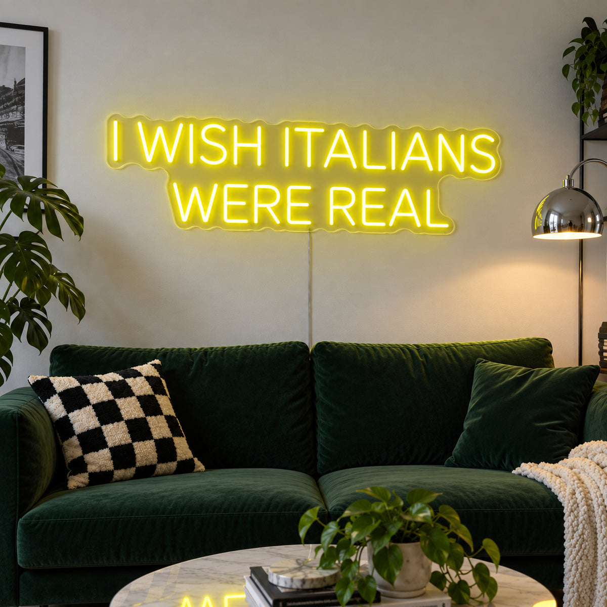 I Wish Italians Were Real Neon Sign with yellow lighting, displayed above a green sofa.