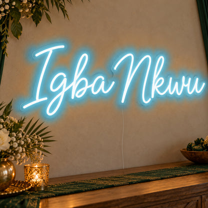 Igba Nkwu Neon Sign in ice blue LED neon on clear acrylic, angled view