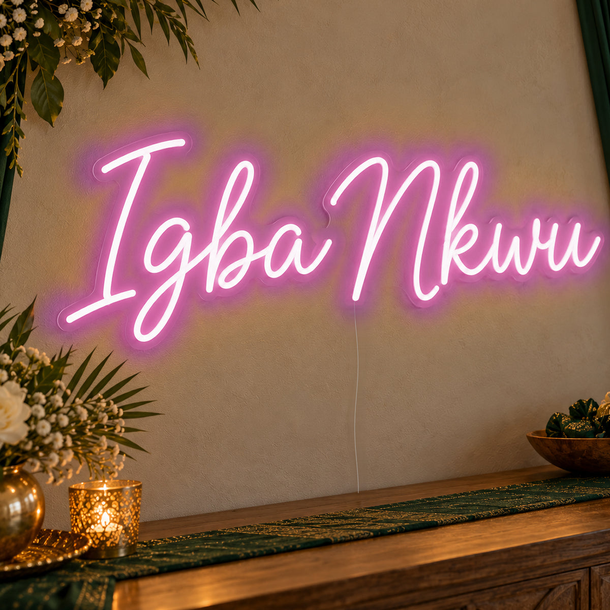 Igba Nkwu Neon Sign in pink LED neon on clear acrylic, angled view