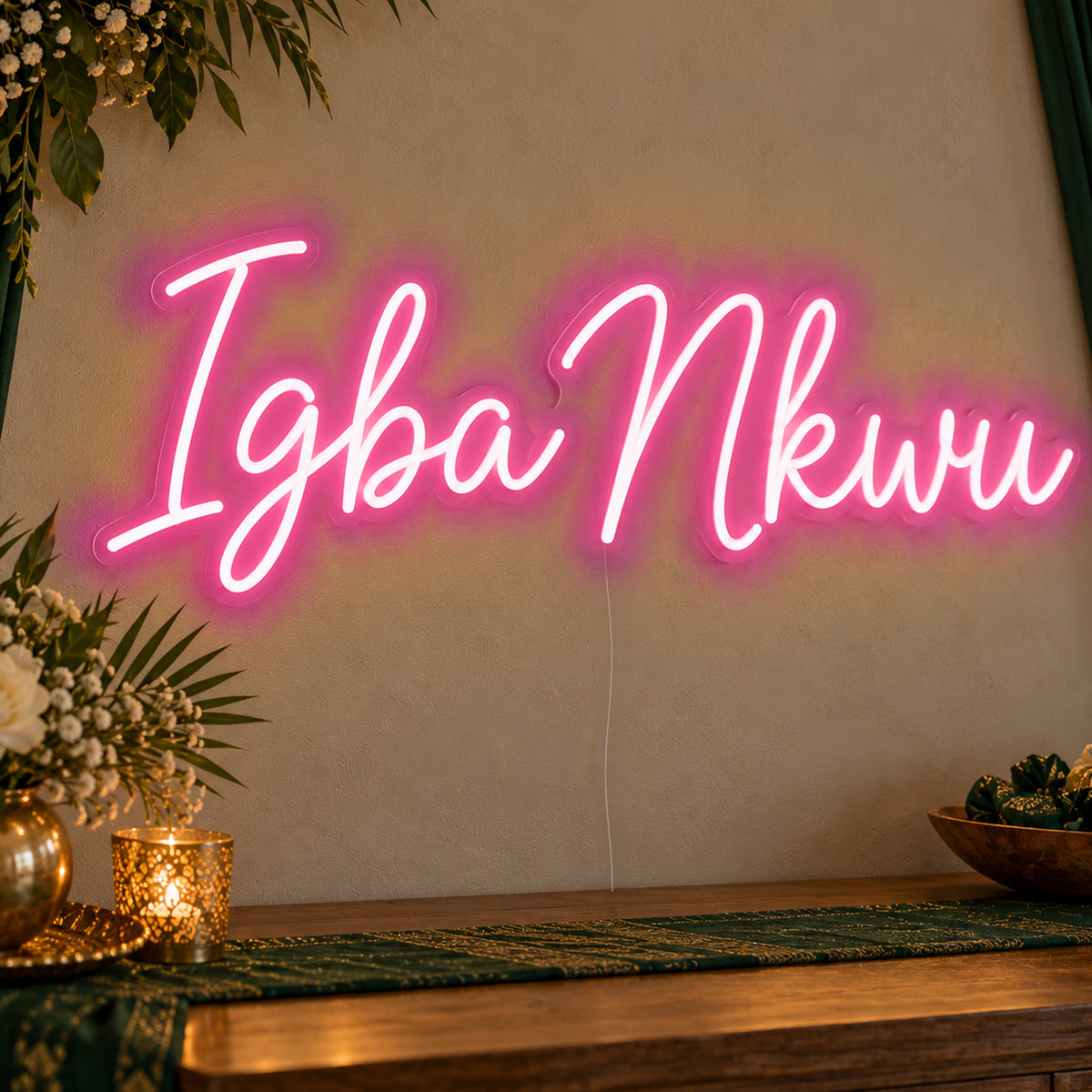 Igba Nkwu Neon Sign in rose red LED neon on clear acrylic, angled view