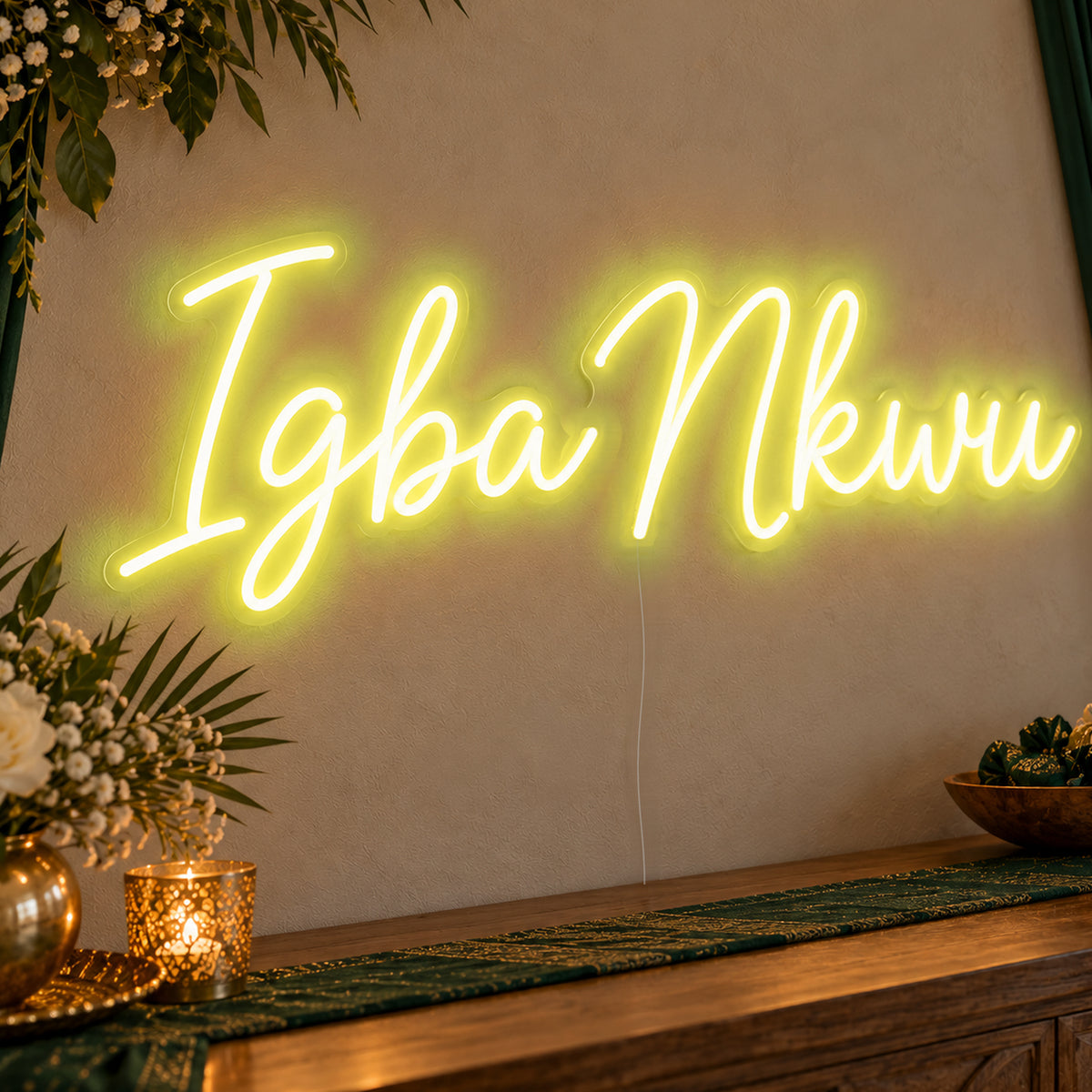 Igba Nkwu Neon Sign in yellow LED neon on clear acrylic, angled view