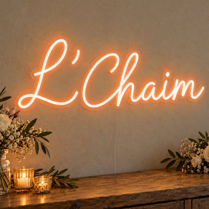 L’Chaim Neon Sign in orange LED neon on clear acrylic, angled view