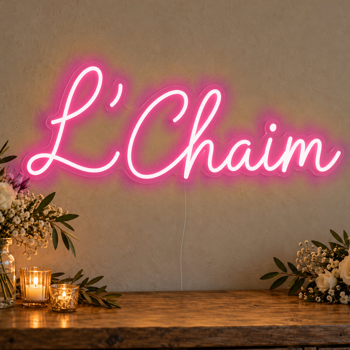 L’Chaim Neon Sign in rose red LED neon on clear acrylic, angled view