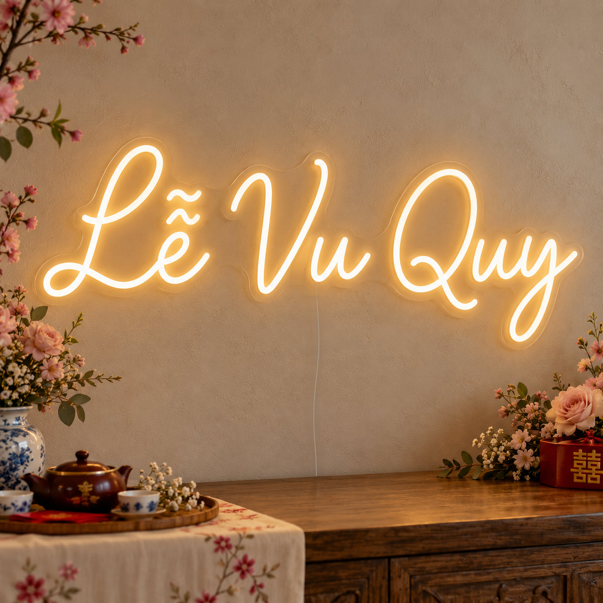 Lễ Vu Quy Neon Sign on clear cut-to-shape acrylic, illuminated on a wall in a styled celebration setting