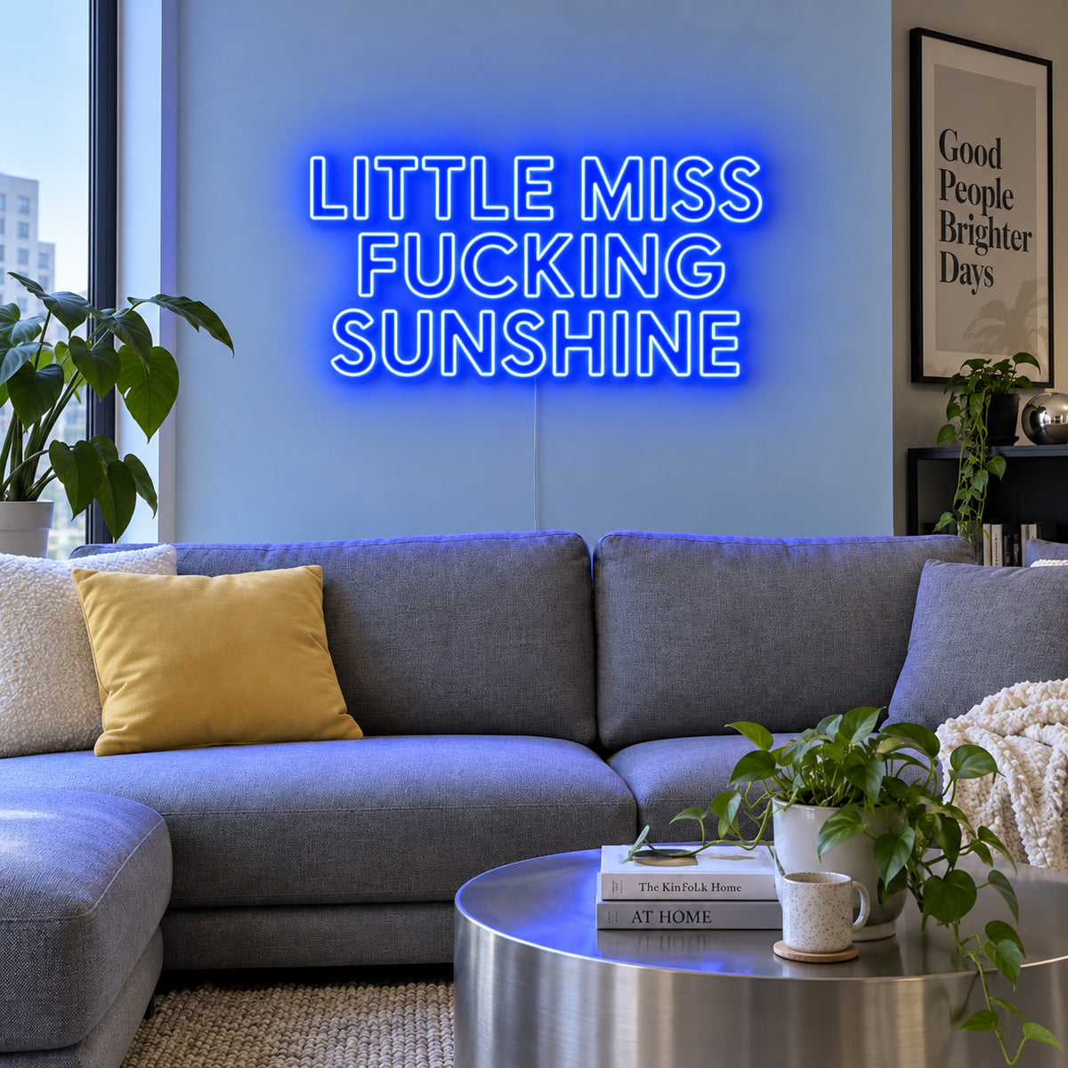 Little Miss Fucking Sunshine Neon Sign glowing blue above a grey sofa with yellow cushions.