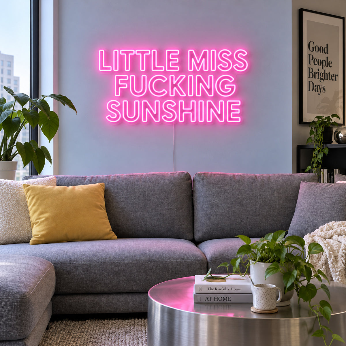 Little Miss Fucking Sunshine Neon Sign glowing pink above a grey sofa with yellow cushions.