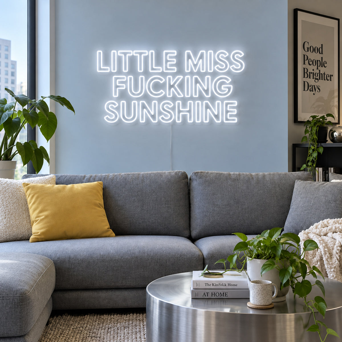 Little Miss Fucking Sunshine Neon Sign glowing white above a grey sofa with yellow cushions.