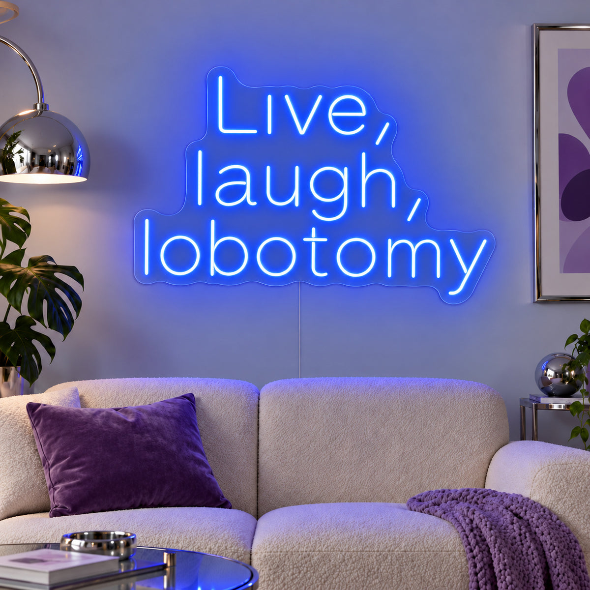 Live, Laugh, Lobotomy Neon Sign glowing blue above a cream sofa with purple cushions.