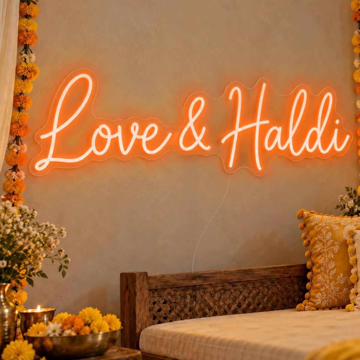 Love Haldi Neon Sign in orange LED neon on clear acrylic, angled view