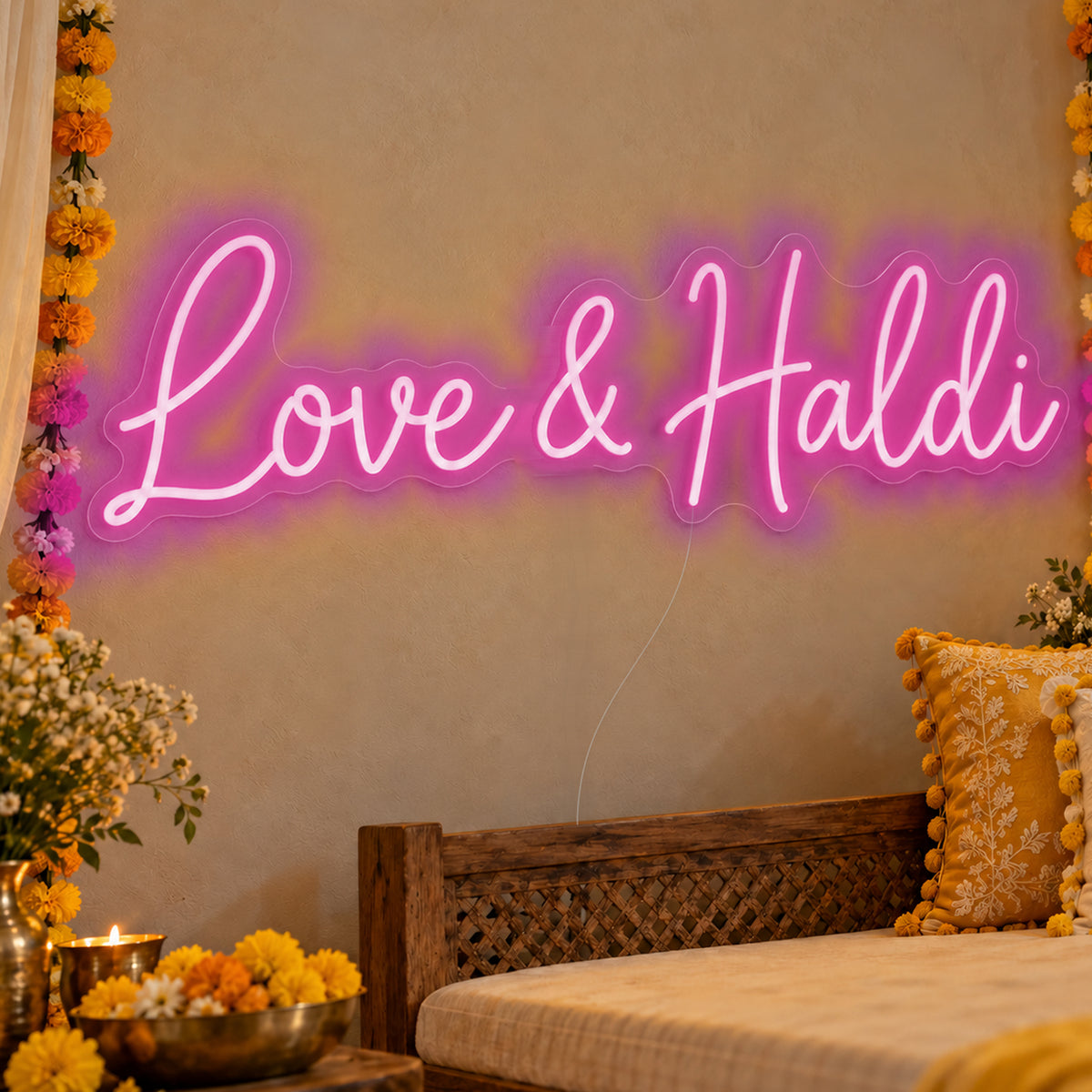 Love Haldi Neon Sign in pink LED neon on clear acrylic, angled view