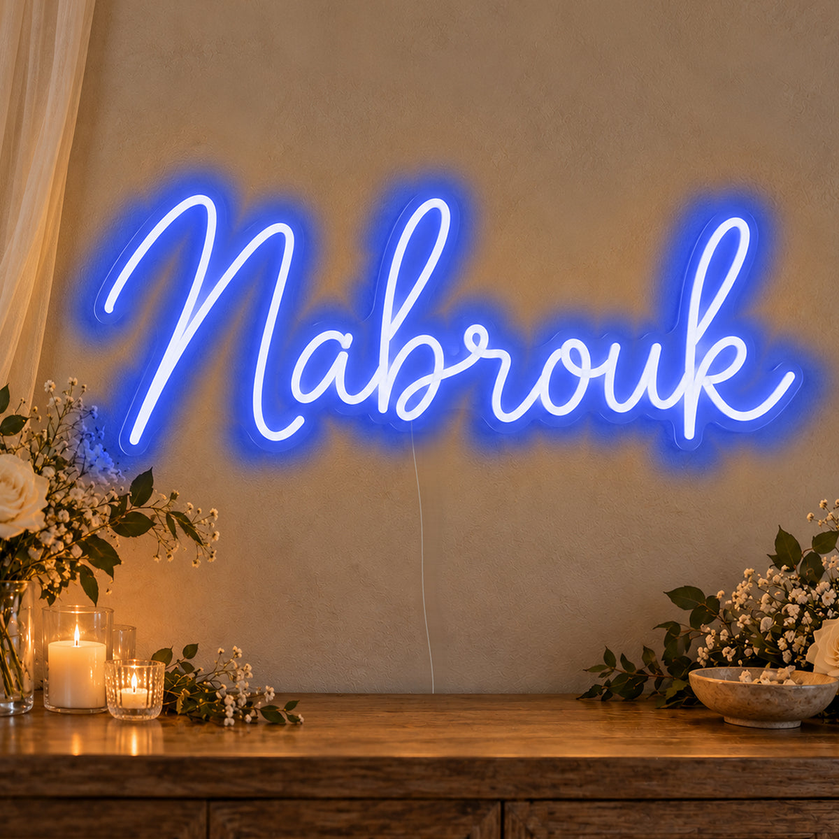 Mabrouk Neon Sign in blue LED neon on clear acrylic, angled view