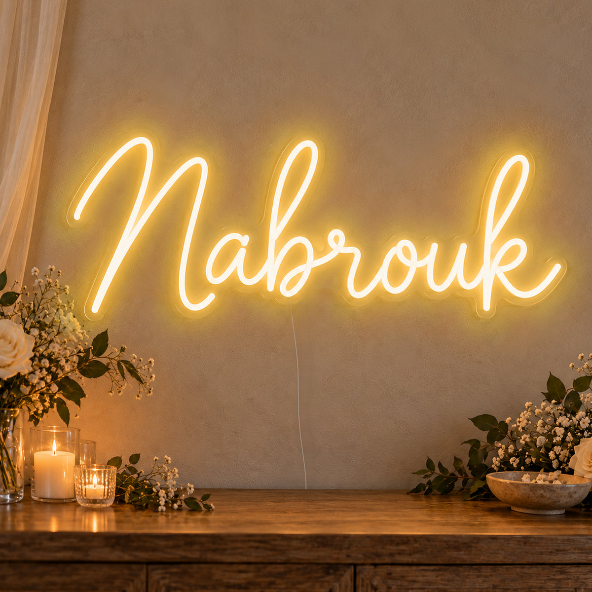 Mabrouk Neon Sign in gold LED neon on clear acrylic, angled view