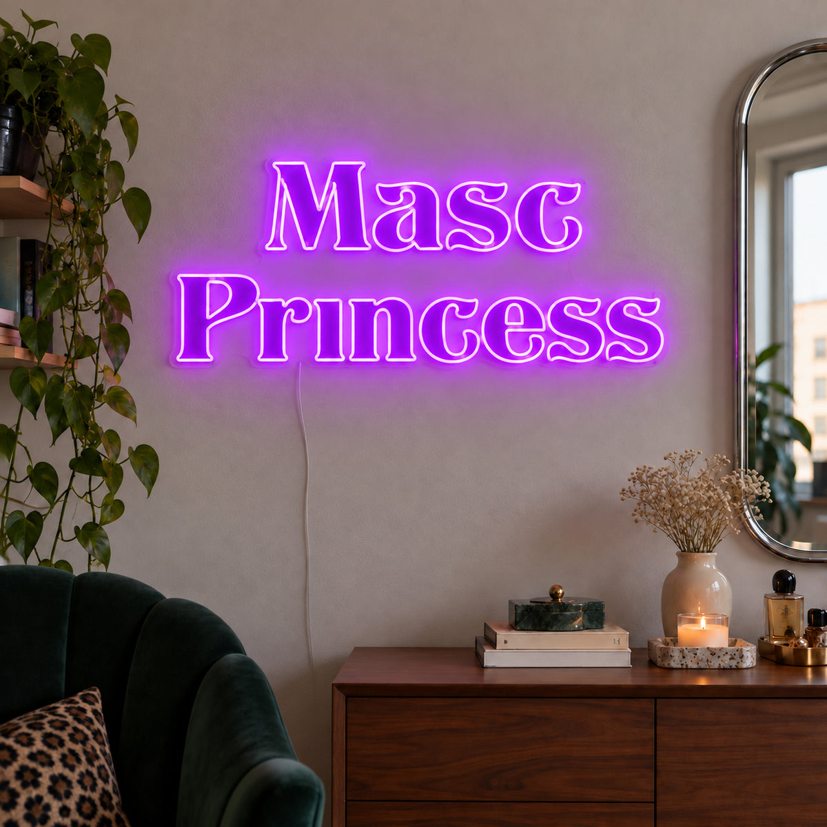 Masc Princess Neon Sign with purple lighting, displayed above a wooden sideboard beside a green chair.