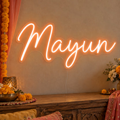 Mayun Neon Sign in orange LED neon on clear acrylic, angled view