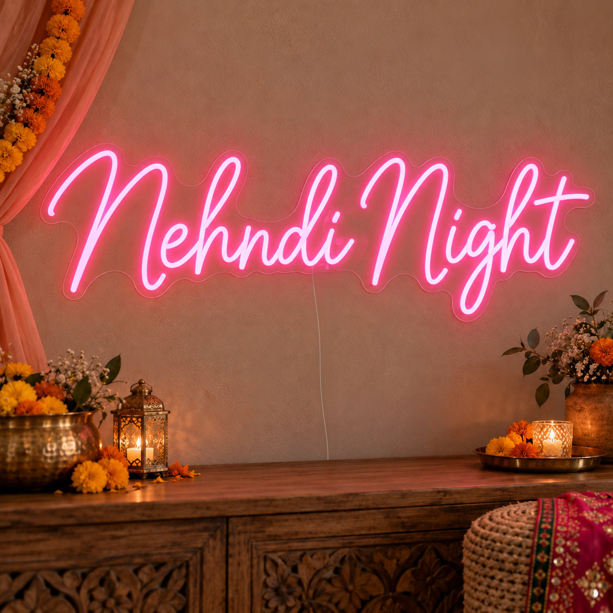 Mehndi Night Neon Sign on clear cut-to-shape acrylic, illuminated on a wall in a styled celebration setting