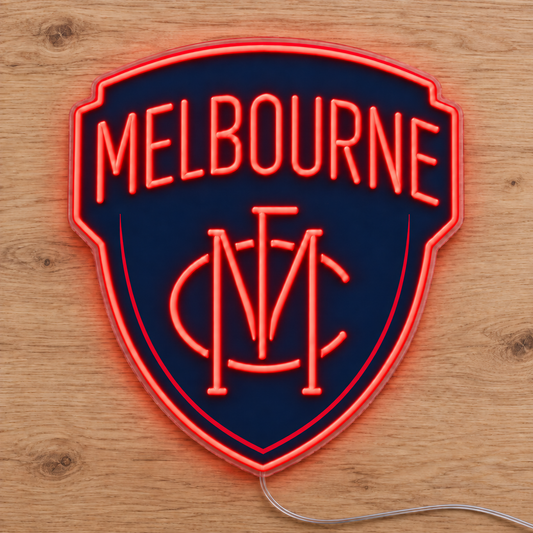 Melbourne Demons Neon Sign with red LED neon on a wooden surface, photographed from above