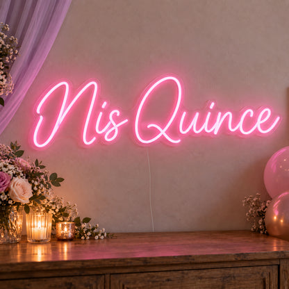 Mis Quince Neon Sign on clear cut-to-shape acrylic, illuminated on a wall in a styled celebration setting