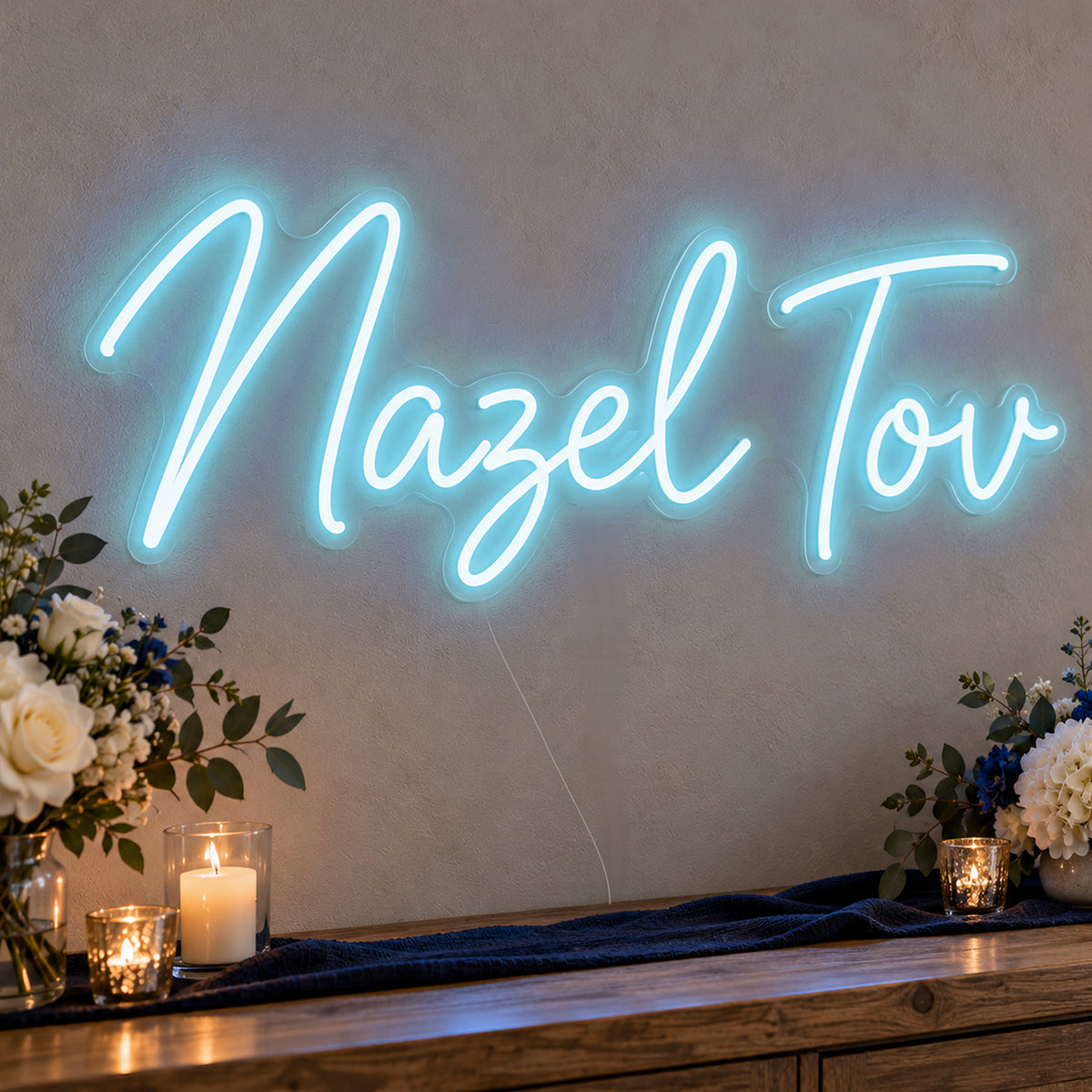 Mazel Tov Blue Neon Sign in ice blue LED neon on clear acrylic, angled view