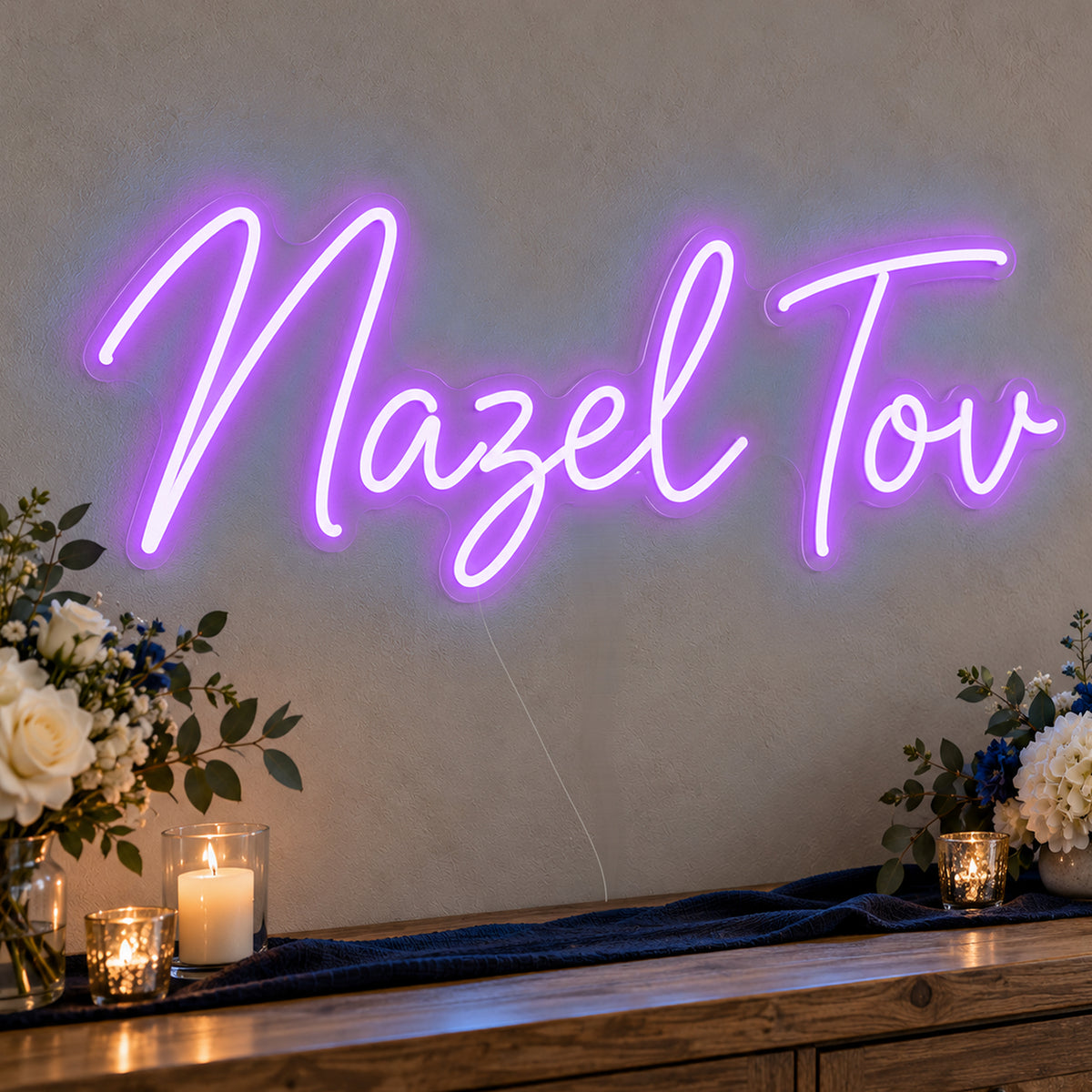 Mazel Tov Blue Neon Sign in purple LED neon on clear acrylic, angled view