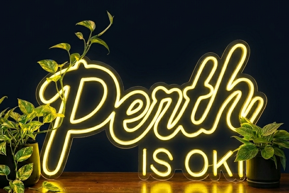 Perth is OK! neon sign on a dark background with plants, shown as custom sign inspiration for Midland.