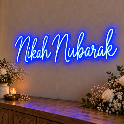 Nikah Mubarak Neon Sign in blue LED neon on clear acrylic, angled view