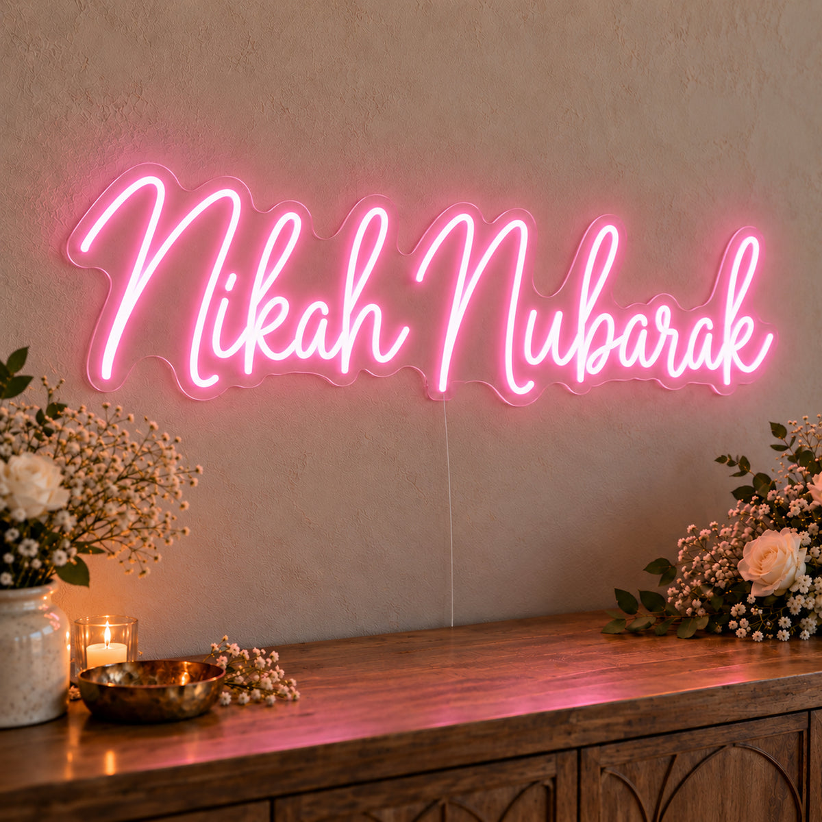 Nikah Mubarak Neon Sign in pink LED neon on clear acrylic, angled view