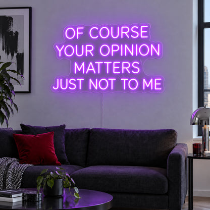 Of Course Your Opinion Matters Just Not To Me Neon Sign with purple lighting, displayed above a black sofa.
