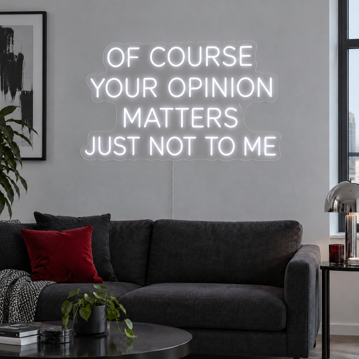 Of Course Your Opinion Matters Just Not To Me Neon Sign, RGB colour-changing option shown in white above a black sofa.