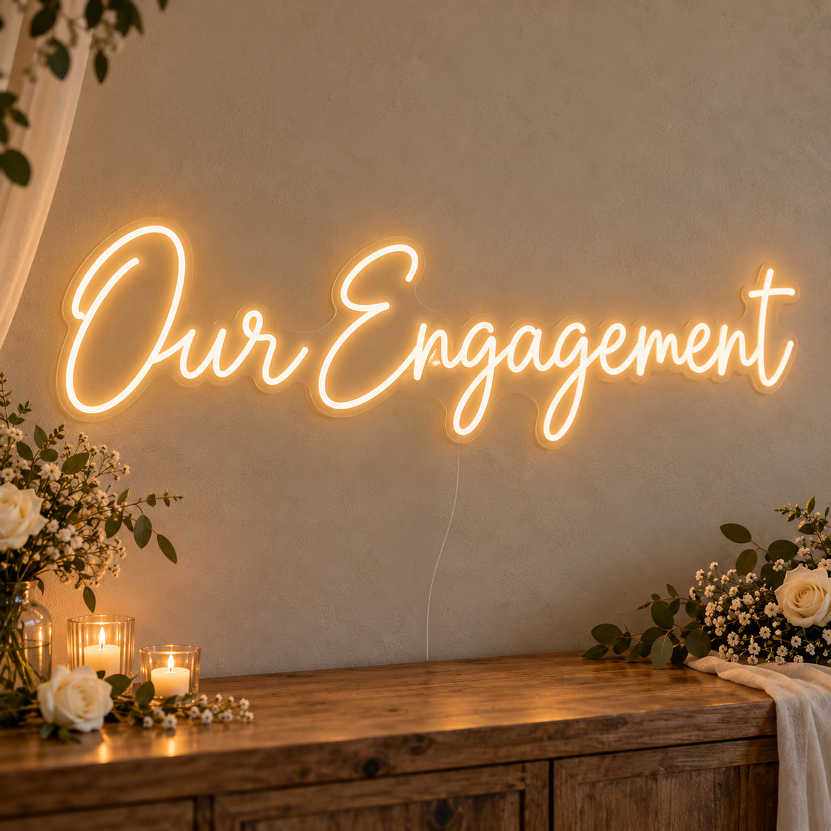 Our Engagement Neon Sign on clear cut-to-shape acrylic, illuminated on a wall in a styled celebration setting