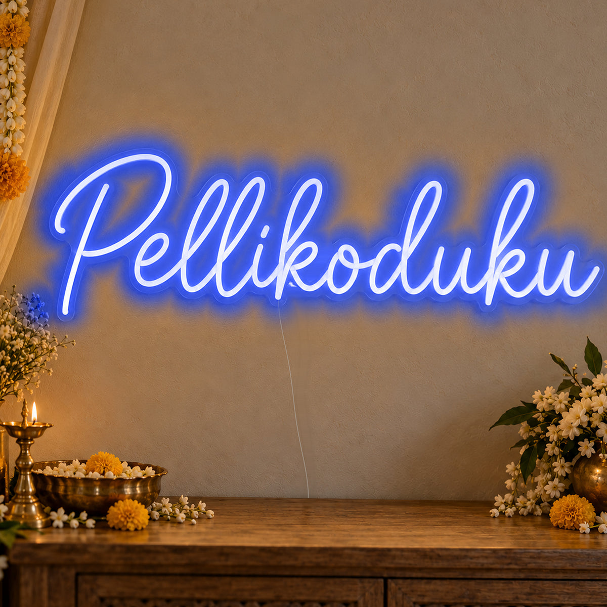 Pellikoduku Neon Sign in blue LED neon on clear acrylic, angled view