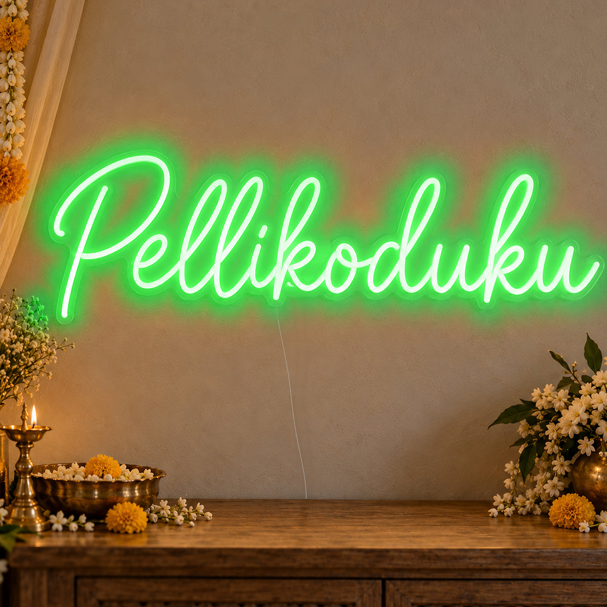 Pellikoduku Neon Sign in green LED neon on clear acrylic, angled view