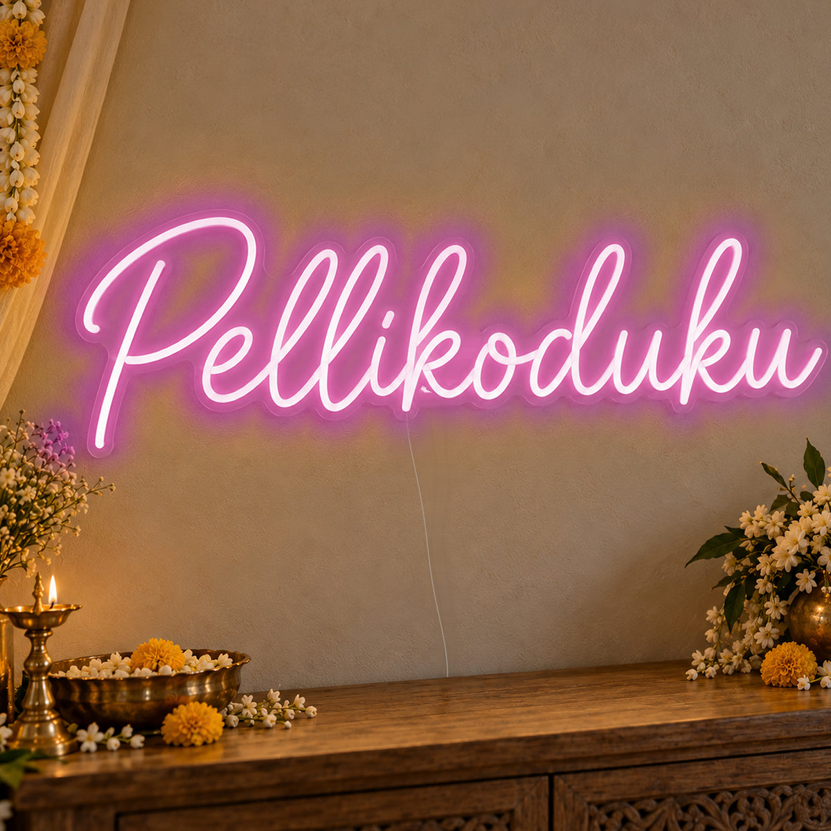 Pellikoduku Neon Sign in pink LED neon on clear acrylic, angled view
