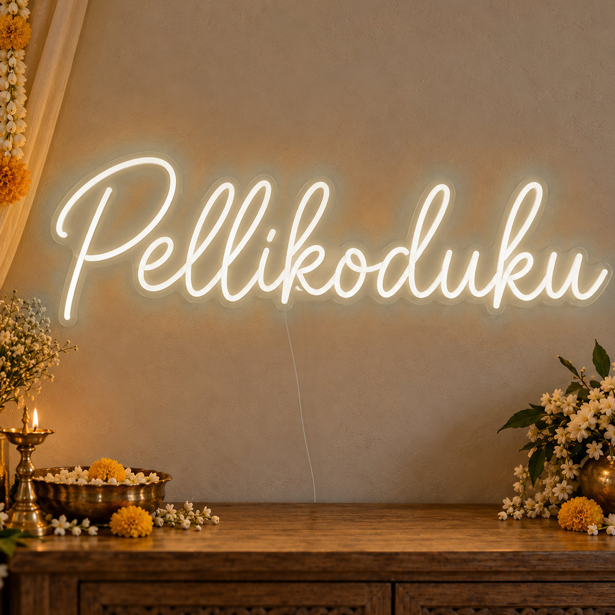 Pellikoduku Neon Sign in warm white LED neon on clear acrylic, angled view