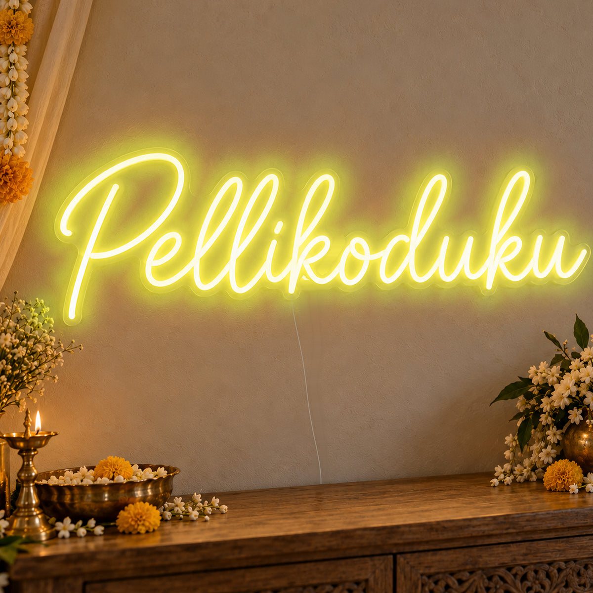 Pellikoduku Neon Sign in yellow LED neon on clear acrylic, angled view