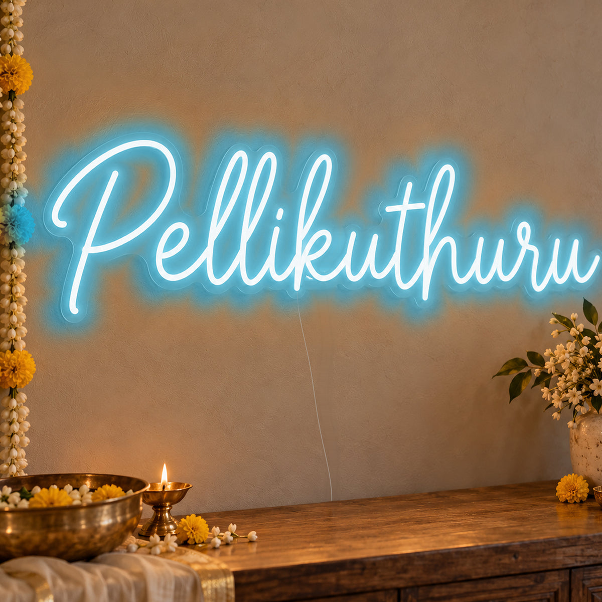Pellikuthuru Neon Sign in ice blue LED neon on clear acrylic, angled view