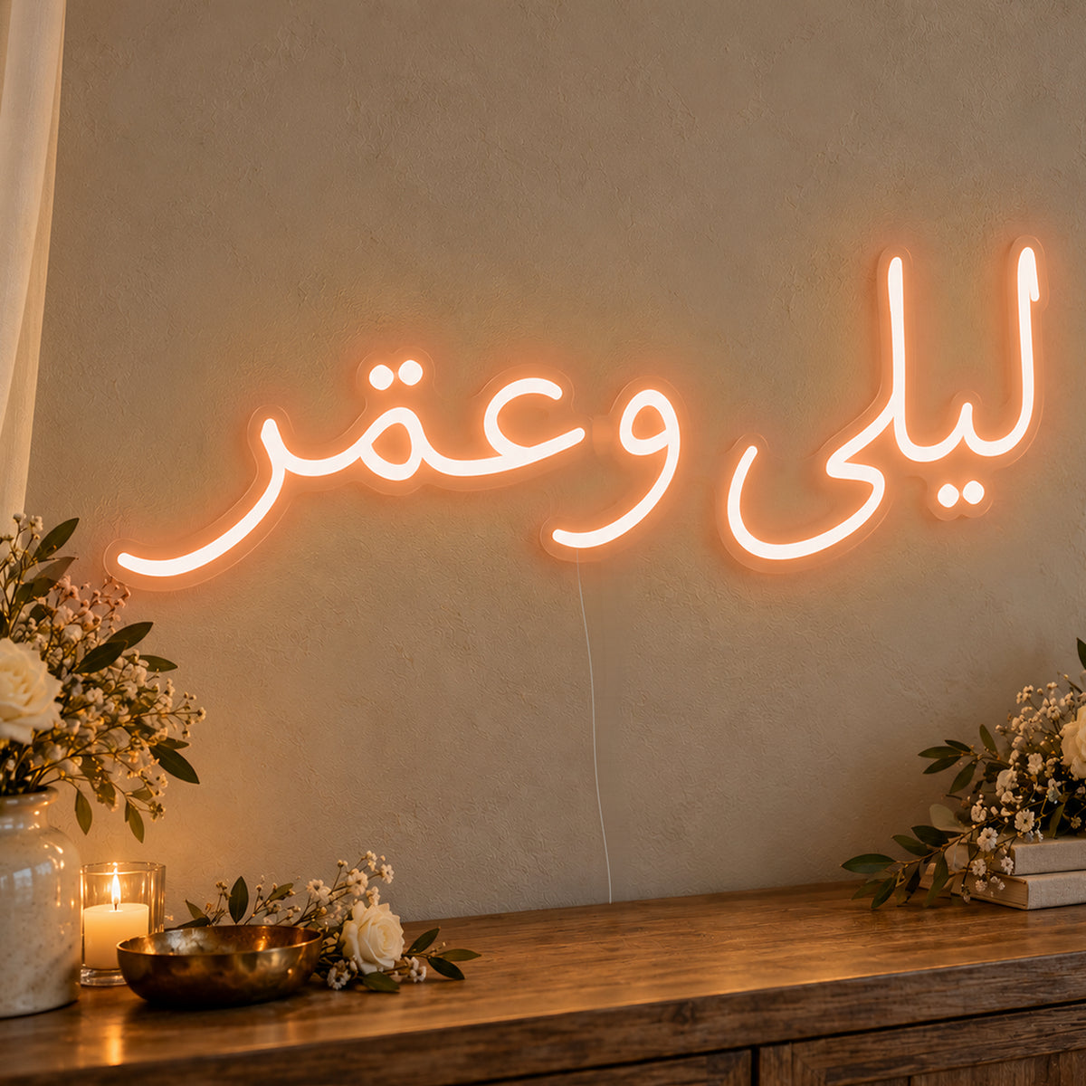 Personalised Arabic Couple Names Neon Sign in orange LED neon on clear acrylic, angled view