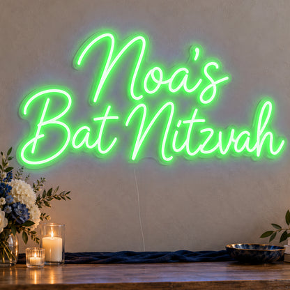 Personalised Bat Mitzvah Neon Sign in green LED neon on clear acrylic, angled view