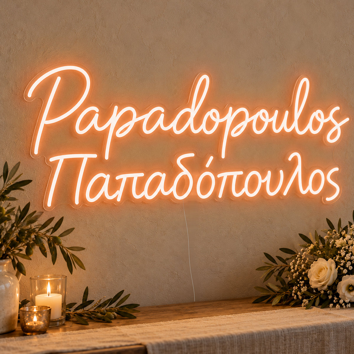 Personalised Bilingual Greek Surname Neon Sign in orange LED neon on clear acrylic, angled view