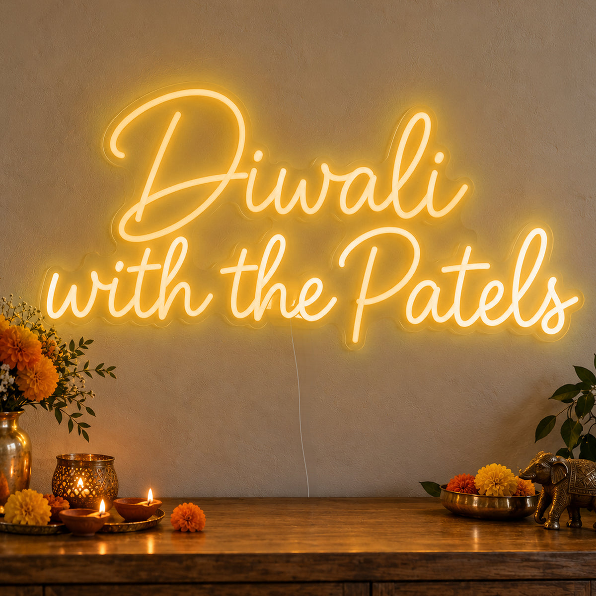 Personalised Family Diwali Neon Sign in gold LED neon on clear acrylic, angled view