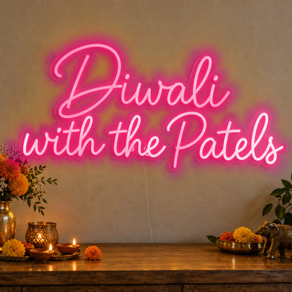 Personalised Family Diwali Neon Sign in rose red LED neon on clear acrylic, angled view